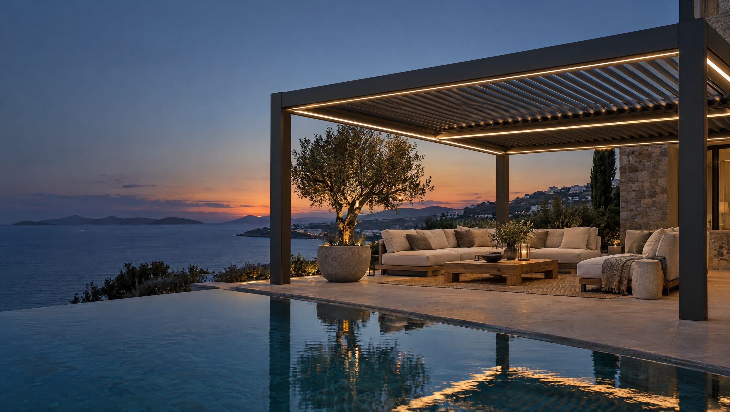 Akşam ışığında villa terası ve antrasit bioklimatik pergole